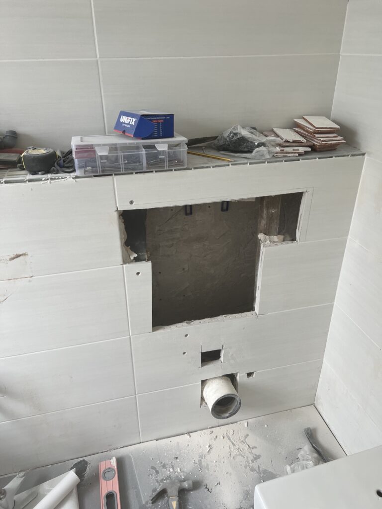 Cut and reinforced for new toilet cistern